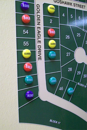 A close-up image of a map with magnetic buttons attached