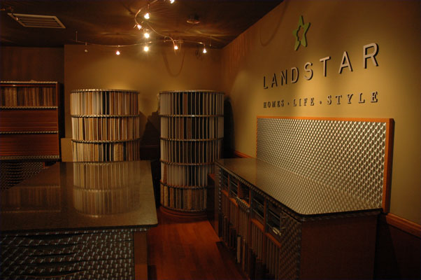 The Landstar Homes showroom showing carpet samples and metal countertops