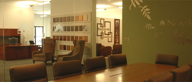 The Novikoff Furniture showroom conference room with a large table and six executive chairs