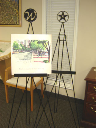Two custom metal easels with company logos embedded in the frame
