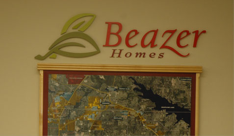 The Beazer Homes logo cut from foam board with painted