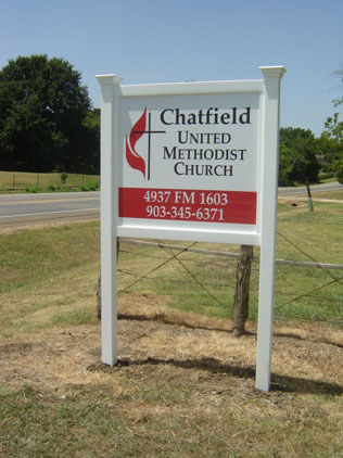 Small sign with decorative posts for the Chatfield United Methodist Church