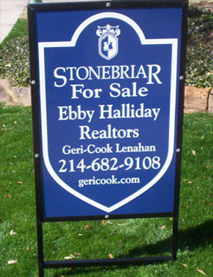 A blue real estate sign at the Stonebriar development